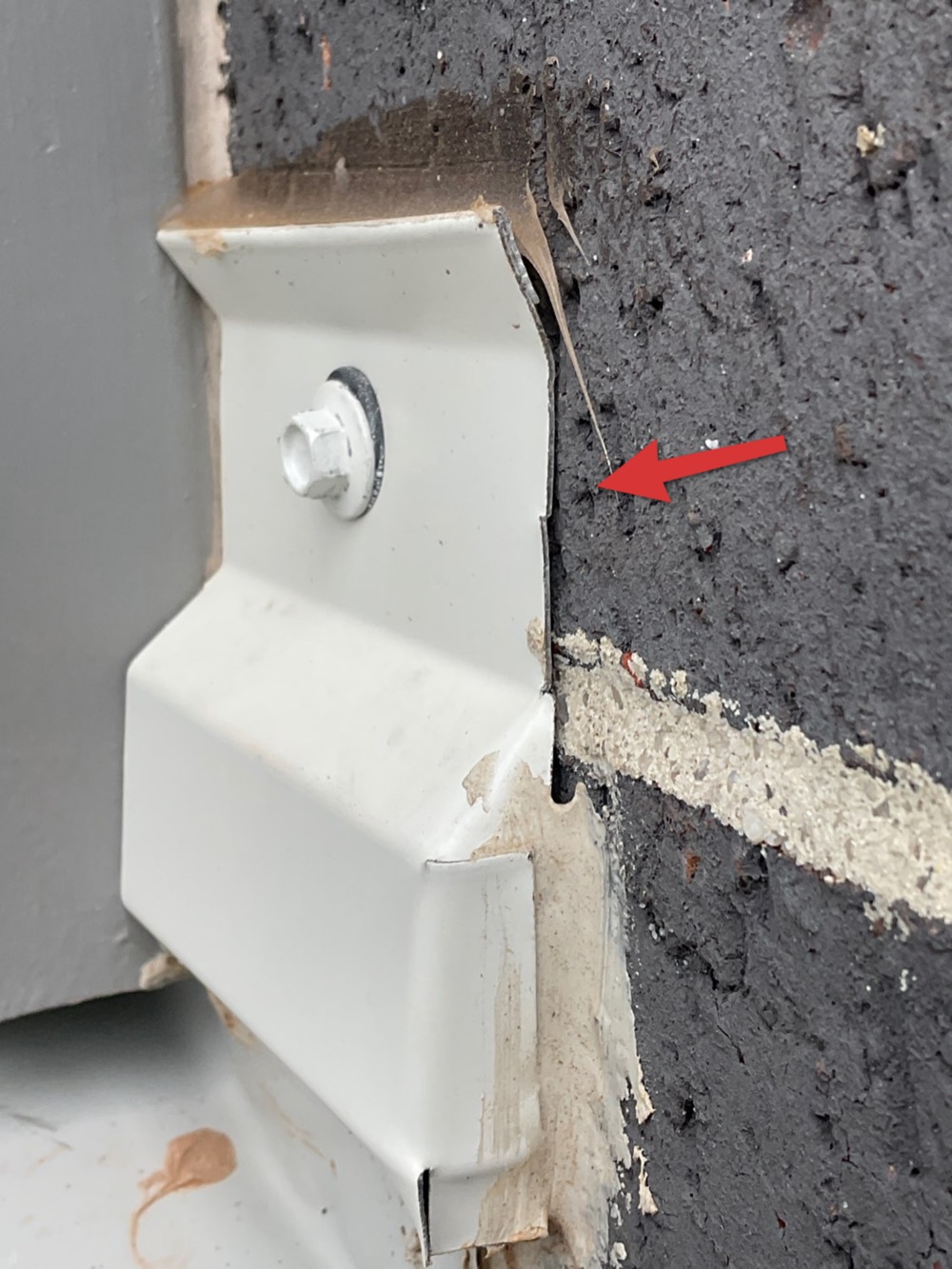 Flashing sitting on the face of the cladding rather than behind it, recorded during a pre-handover inspection in Bacchus Marsh, 18 km from Rockbank
