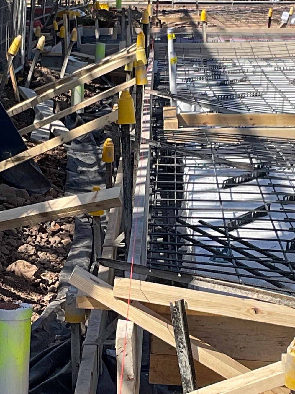 Formwork boards not straight and needing adjustment, Rockbank