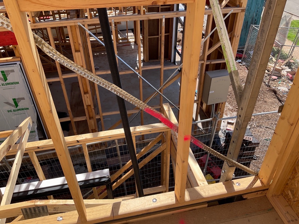 Metal strap bracing installed but not tensioned, recorded during a frame inspection in Fraser Rise, 4 km from Rockbank